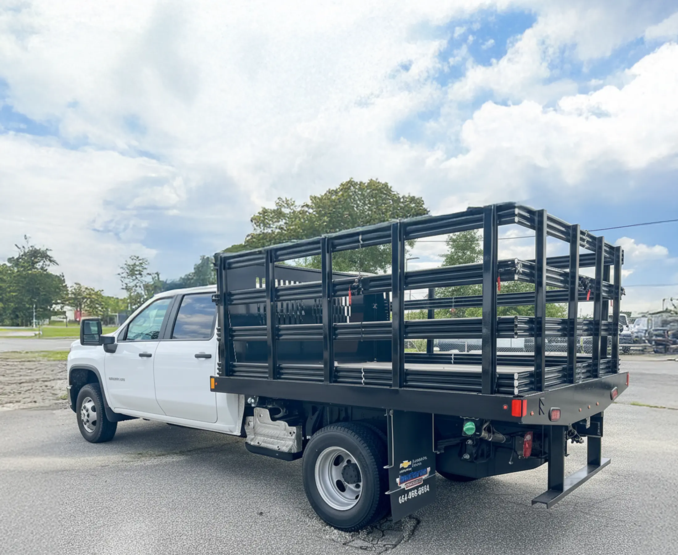 Silverado 3500HD with Knapheide gooseneck platform body, rear three-quarter view